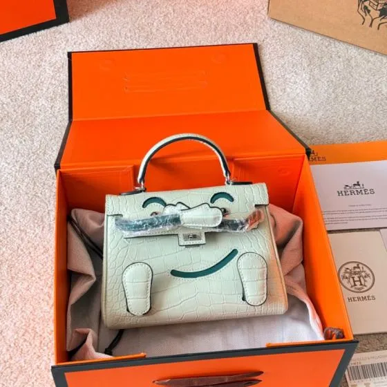 Hermes Kelly Doll Off-white crocodile embossed leather with green accents crossbody