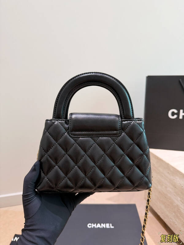 Chanel Kelly Black quilted leather with pearl floral embellishment top handle — Premium Replica