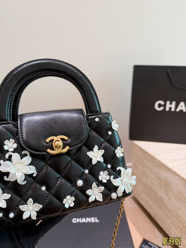 Chanel Kelly Black quilted leather with pearl floral embellishment top handle — Premium Replica