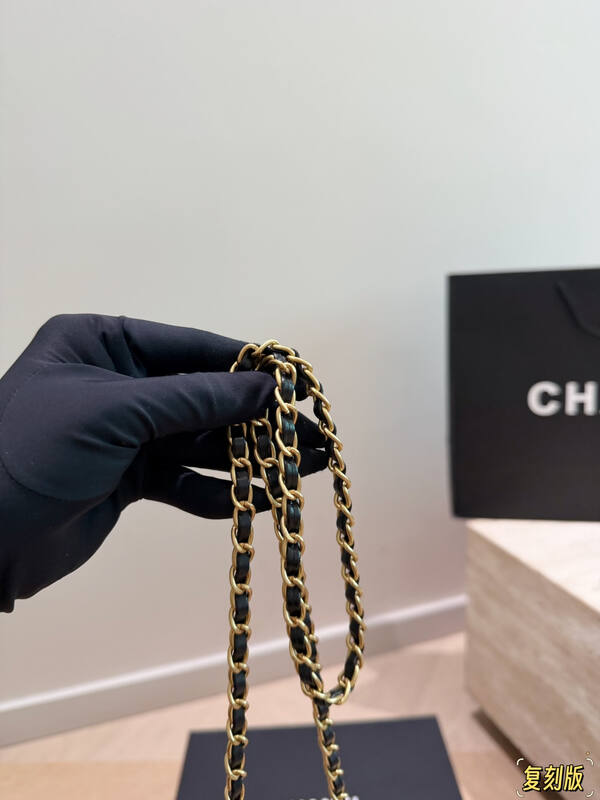 Chanel Kelly Black quilted leather with pearl floral embellishment top handle — Premium Replica