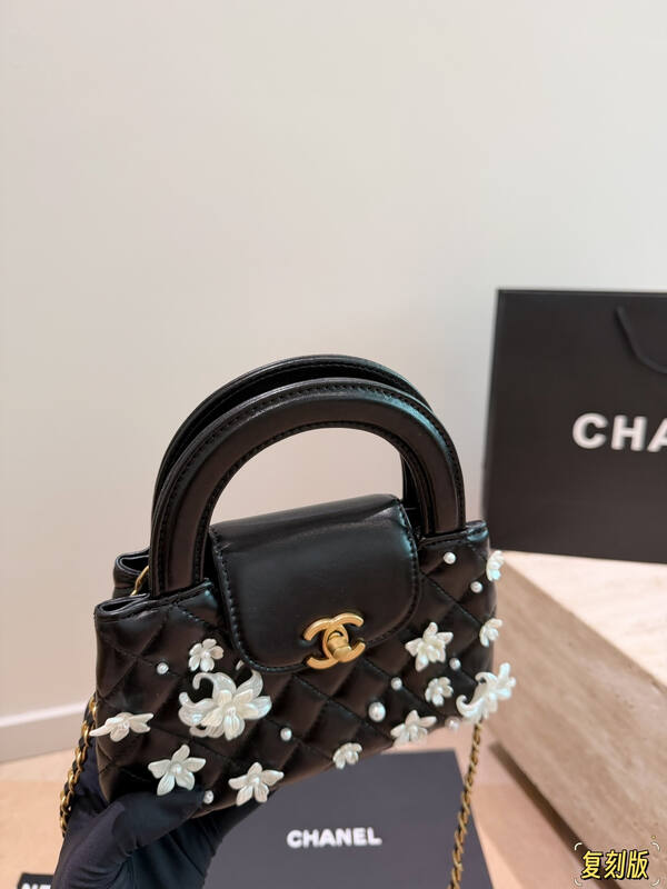 Chanel Kelly Black quilted leather with pearl floral embellishment top handle — Premium Replica